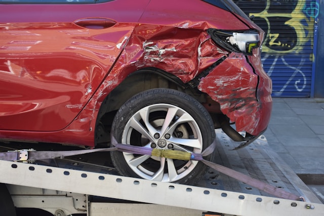Damaged car representing the forces involved in low-impact whiplash injuries